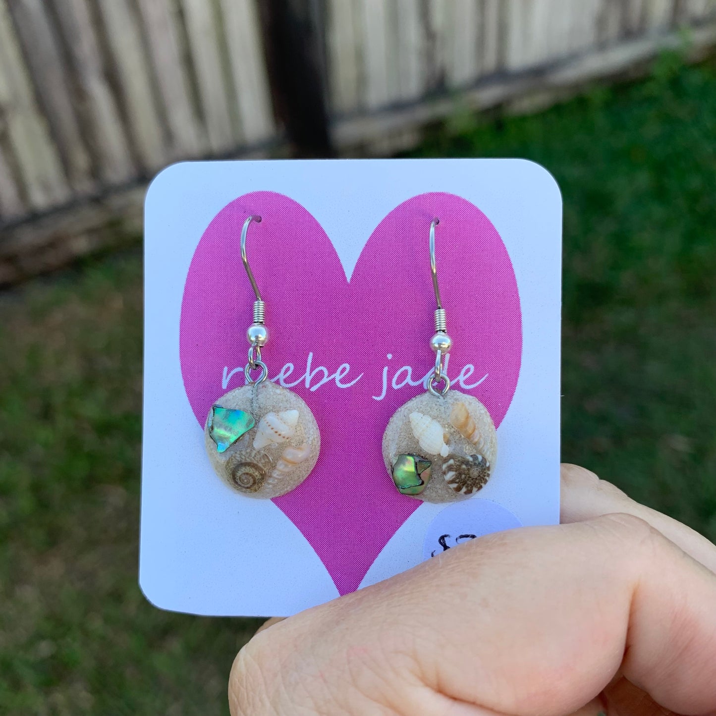 Mermaid inspired dangle earrings with sand, shell and paua shell.