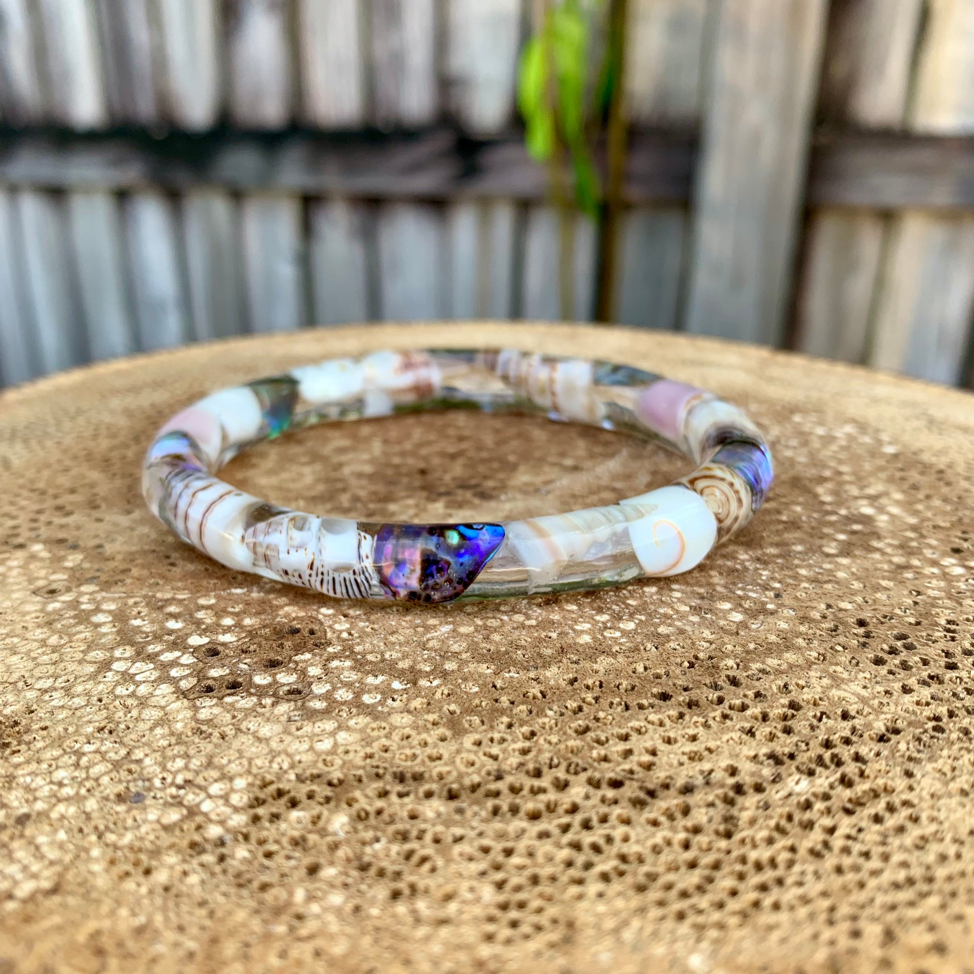 Real shells in an epoxy resin bangle. 