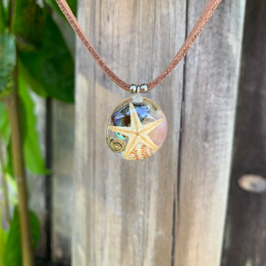 Starfish necklace with paua shell on leather cord
