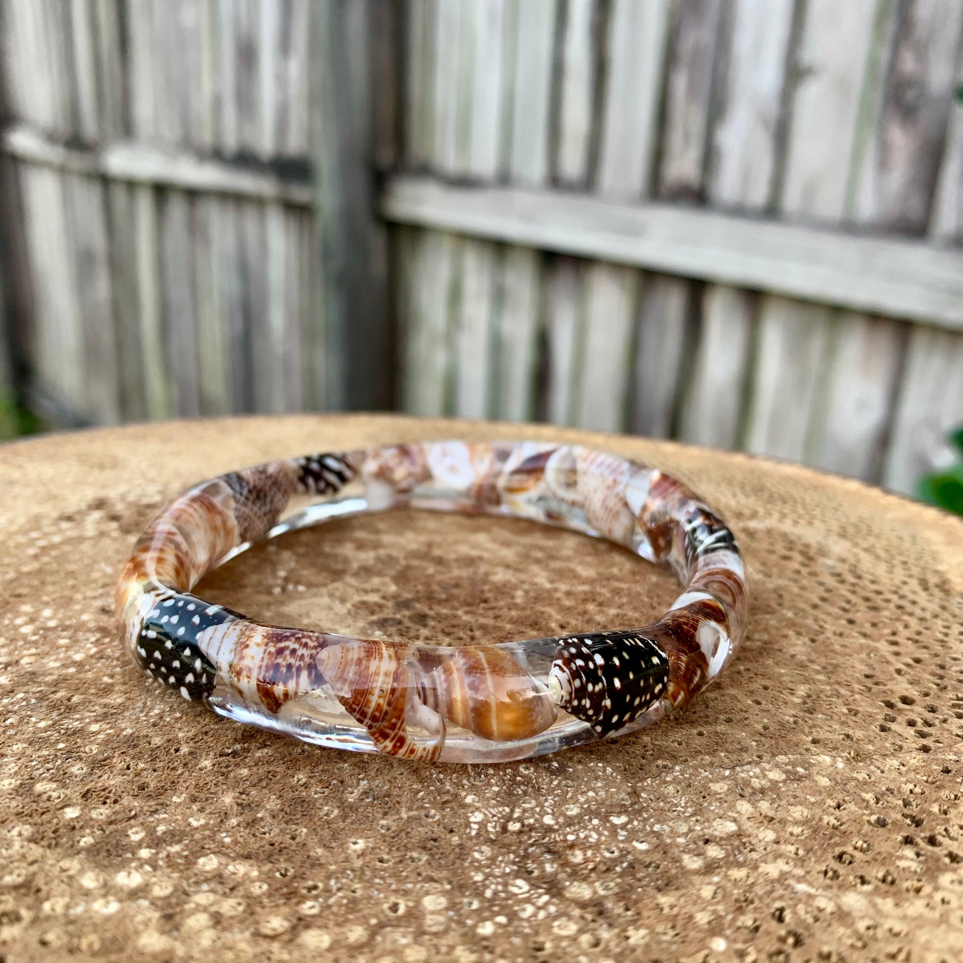 Seashell bangle made with resin and real brown seashells 